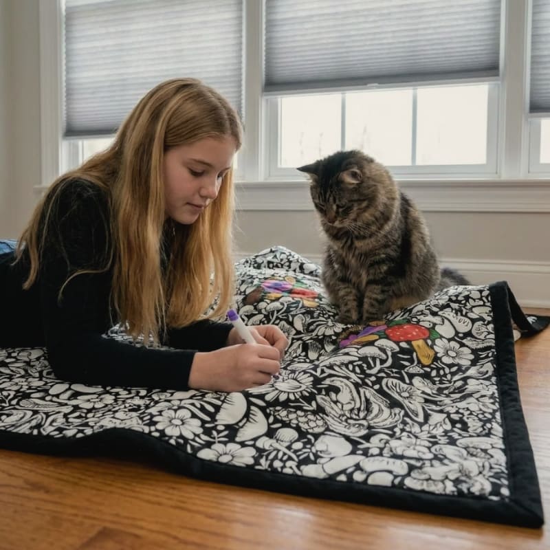 Customer relaxing under the washable colouring blanket