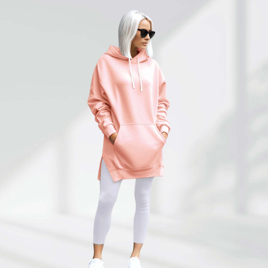 Woman wearing the blush pink Wear the Shape hoodie dress