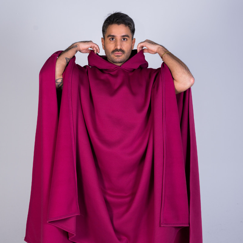 Front view of the red Hoodly hoodie blanket held open